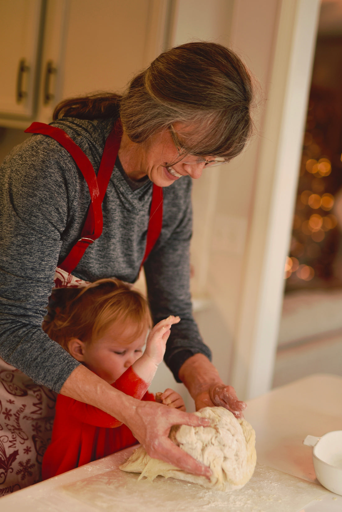 Grandmother and granddaughter enjoying family Christmas activities